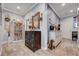 Bright foyer with beautiful wood-look tile flooring and elegant decorative touches at 6929 Benson Ferry St, Las Vegas, NV 89149