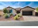 Charming single-story home with well-manicured front yard and a two-car garage at 6929 Benson Ferry St, Las Vegas, NV 89149