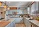 Modern kitchen with stainless appliances, gray cabinets, and spacious granite countertops at 6929 Benson Ferry St, Las Vegas, NV 89149