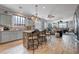 Charming kitchen with gray cabinets, granite countertops, and an island with bar stool seating at 6929 Benson Ferry St, Las Vegas, NV 89149