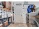 Well-organized laundry room with front-loading washer and dryer, stylish tile work, and ample storage space at 6929 Benson Ferry St, Las Vegas, NV 89149