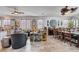 Open-concept living area combining kitchen, seating, and dining spaces at 6929 Benson Ferry St, Las Vegas, NV 89149