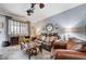 Cozy living room with ample seating, decorative lighting, and natural light at 6929 Benson Ferry St, Las Vegas, NV 89149