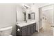 Bathroom with a vanity with marble countertop and views into adjacent bedroom at 700 Carnegie St # 3214, Henderson, NV 89052