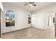 Bright bedroom with natural light, arched windows, and an ensuite bathroom entrance at 700 Carnegie St # 3214, Henderson, NV 89052