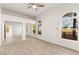 Spacious bedroom featuring a ceiling fan, sliding mirrored closet and arched windows at 700 Carnegie St # 3214, Henderson, NV 89052