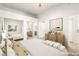 Bright bedroom with a large bed, mirrored closet and stylish furniture, virtually staged at 700 Carnegie St # 3214, Henderson, NV 89052