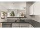 Open kitchen featuring stainless steel appliances, sleek countertops, and white cabinets at 700 Carnegie St # 3214, Henderson, NV 89052