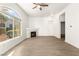 Bright living room featuring a fireplace, large arched windows, and light wood-look flooring at 700 Carnegie St # 3214, Henderson, NV 89052