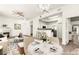 Open concept living room with fireplace, dining area, and kitchen access at 700 Carnegie St # 3214, Henderson, NV 89052