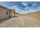 Expansive, unfinished backyard with cinder block fence, perfect for creating your dream outdoor oasis at 728 Omaggio Pl, Henderson, NV 89011