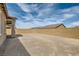 Large, unfinished backyard featuring a tall cinder block fence, awaiting your personal touch for landscaping and recreation at 728 Omaggio Pl, Henderson, NV 89011