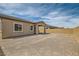Expansive backyard features gravel and covered patio, providing ample room for relaxation and entertainment at 728 Omaggio Pl, Henderson, NV 89011