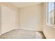 A carpeted bedroom features a window, neutral walls and a closet with bi-fold doors at 728 Omaggio Pl, Henderson, NV 89011