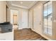 Bright foyer featuring luxury vinyl plank flooring, and high ceilings that create an inviting atmosphere at 728 Omaggio Pl, Henderson, NV 89011