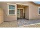 Welcoming front entrance features a covered porch, beautiful door, and lovely landscaping at 728 Omaggio Pl, Henderson, NV 89011
