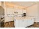 Well-appointed kitchen features an island, stainless steel appliances, and a built-in microwave at 728 Omaggio Pl, Henderson, NV 89011
