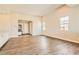 Spacious living area features hardwood flooring, neutral walls, and natural light at 728 Omaggio Pl, Henderson, NV 89011