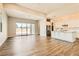 An open-concept living area with hardwood floors connects seamlessly to the modern kitchen at 728 Omaggio Pl, Henderson, NV 89011