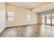 Bright and open living room featuring hardwood floors, recessed lighting, and neutral paint at 728 Omaggio Pl, Henderson, NV 89011