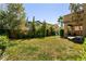 Large backyard with green grass and lush landscaping at 8224 Opal Falls St, North Las Vegas, NV 89085