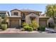 Beautiful two-story home with well-manicured landscaping and a two-car garage at 8224 Opal Falls St, North Las Vegas, NV 89085