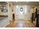 Bright foyer with wood floors, a decorative rug, and an elegant front door at 8224 Opal Falls St, North Las Vegas, NV 89085