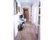 Hallway featuring a small computer desk, built-in shelving, and modern decor at 8224 Opal Falls St, North Las Vegas, NV 89085