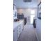 Second-floor hallway features built-in storage, gray carpet, and natural light at 8224 Opal Falls St, North Las Vegas, NV 89085