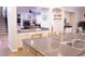 Open kitchen island features granite countertop and double sink, overlooking the living room at 8224 Opal Falls St, North Las Vegas, NV 89085