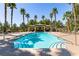 Community pool with lounge chairs and mature landscaping at 8224 Opal Falls St, North Las Vegas, NV 89085