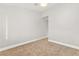 Empty bedroom with carpet, neutral walls, and a doorway to another room at 8528 Sierra Cima Ln, Las Vegas, NV 89128