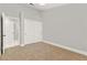 Spacious bedroom with carpet, modern lighting, and a closet with sliding doors at 8528 Sierra Cima Ln, Las Vegas, NV 89128