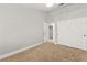 Bright bedroom with carpet flooring, closet, modern lighting, and neutral paint at 8528 Sierra Cima Ln, Las Vegas, NV 89128