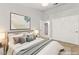 This staged bedroom features neutral tones, a comfortable bed, and minimalist decor for a relaxing retreat at 8528 Sierra Cima Ln, Las Vegas, NV 89128