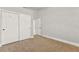 This bedroom features carpet, a sliding door closet and neutral paint at 8528 Sierra Cima Ln, Las Vegas, NV 89128