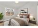 Bright bedroom showcases a large window, modern decor, and comfortable bedding for a cozy and inviting space at 8528 Sierra Cima Ln, Las Vegas, NV 89128