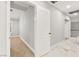 Upstairs hallway with tile floors leads to bedroom with carpet at 8528 Sierra Cima Ln, Las Vegas, NV 89128