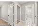 Hallway showing neutral paint, doors, and entry to bedroom and bathroom at 8528 Sierra Cima Ln, Las Vegas, NV 89128