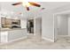 Open concept kitchen featuring modern appliances, marble floors, and neutral color palette at 8528 Sierra Cima Ln, Las Vegas, NV 89128
