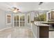 Open kitchen with stainless steel appliances, granite countertops, and access to the backyard at 8528 Sierra Cima Ln, Las Vegas, NV 89128