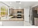 Well-lit kitchen with stainless steel appliances, ample counter space, and stylish cabinetry at 8528 Sierra Cima Ln, Las Vegas, NV 89128