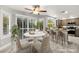 Eat-in kitchen with granite counters, modern appliances, large windows, and backyard views at 8528 Sierra Cima Ln, Las Vegas, NV 89128