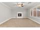 Living room featuring a fireplace and ceiling fan at 8528 Sierra Cima Ln, Las Vegas, NV 89128