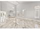 Expansive living area boasts high ceilings, natural light, sleek tile floors and neutral paint at 8528 Sierra Cima Ln, Las Vegas, NV 89128