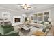 Cozy living room with a fireplace, comfortable seating, and bright windows at 8528 Sierra Cima Ln, Las Vegas, NV 89128