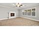 Well-lit living room with a fireplace and window shutters at 8528 Sierra Cima Ln, Las Vegas, NV 89128