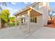 The large covered patio offers shade and complements the home's architectural style at 8528 Sierra Cima Ln, Las Vegas, NV 89128