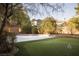 Backyard featuring a sports court and a putting green providing entertainment options for outdoor enjoyment at 9904 Moonridge Ct, Las Vegas, NV 89134