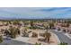 A stunning desert home with solar panels on a tile roof, mature trees, and well-maintained landscaping at , Las Vegas, NV 89134
